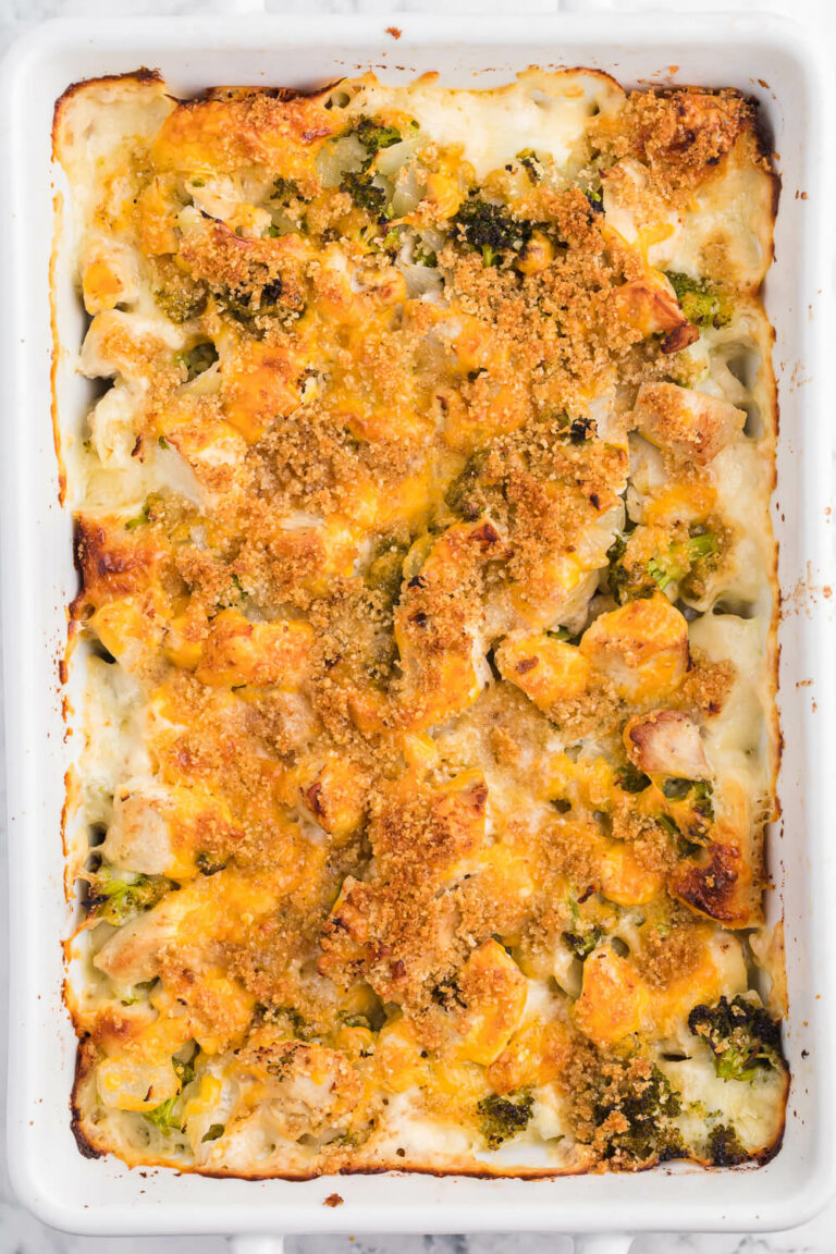 Chicken Broccoli Biscuit Bake - The ultimate comfort food! Country biscuits baked in a creamy Alfredo sauce and topped with broccoli, garlic onions and melted cheese. SO GOOD!