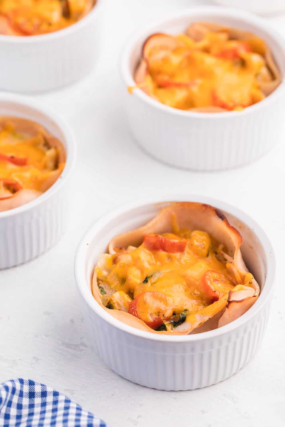 Chicken and Egg Ramekins - A brunch recipe your family will love! Chicken, eggs, cheese and fresh basil are baked to perfection in a ramekin.