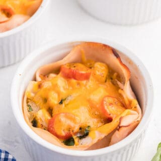 Chicken and Egg Ramekins - A brunch recipe your family will love! Chicken, eggs, cheese and fresh basil are baked to perfection in a ramekin.