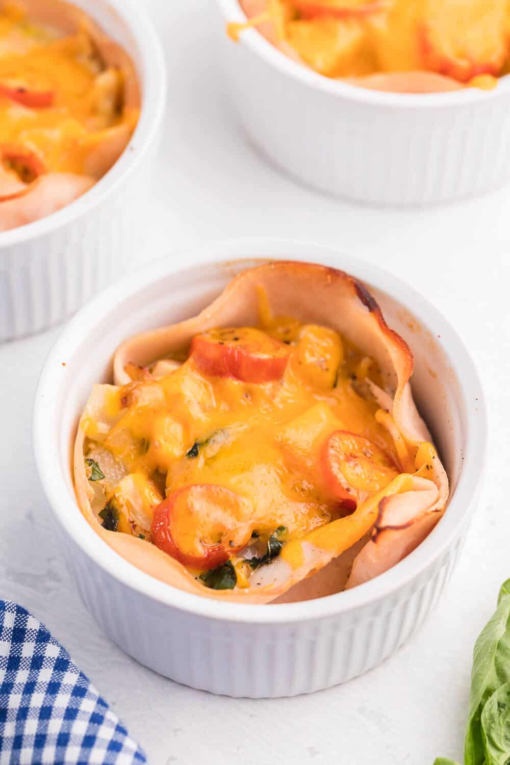 Chicken and Egg Ramekins - A brunch recipe your family will love! Chicken, eggs, cheese and fresh basil are baked to perfection in a ramekin.