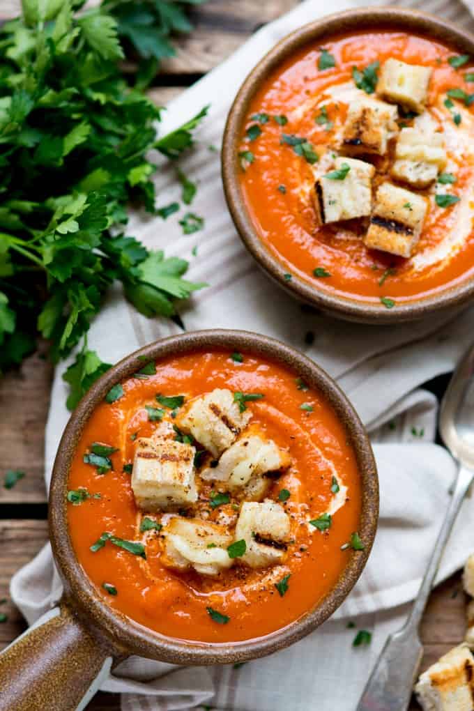 Creamy Tomato Soup with Cheese Toast Croutons - Sit down and enjoy a bowl of this smooth, creamy, flavourful soup for lunch. The grilled cheese croutons elevate this comfort food to a whole new level!