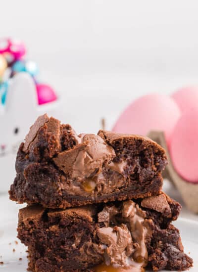 A stack of Easter Egg Stuffed Brownies cut in half.