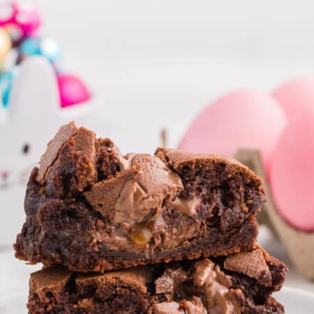 A stack of Easter Egg Stuffed Brownies cut in half.