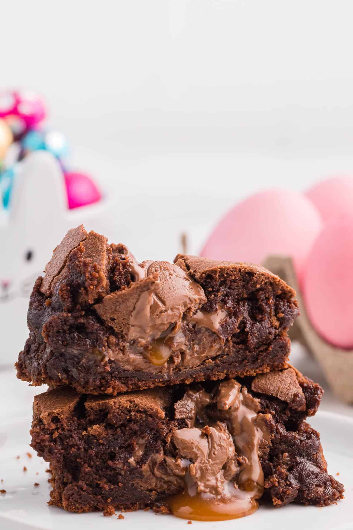 A stack of Easter Egg Stuffed Brownies cut in half.