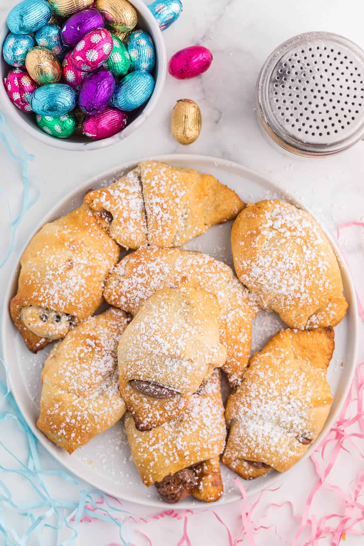 Easter egg stuffed crescent rolls on a plate.