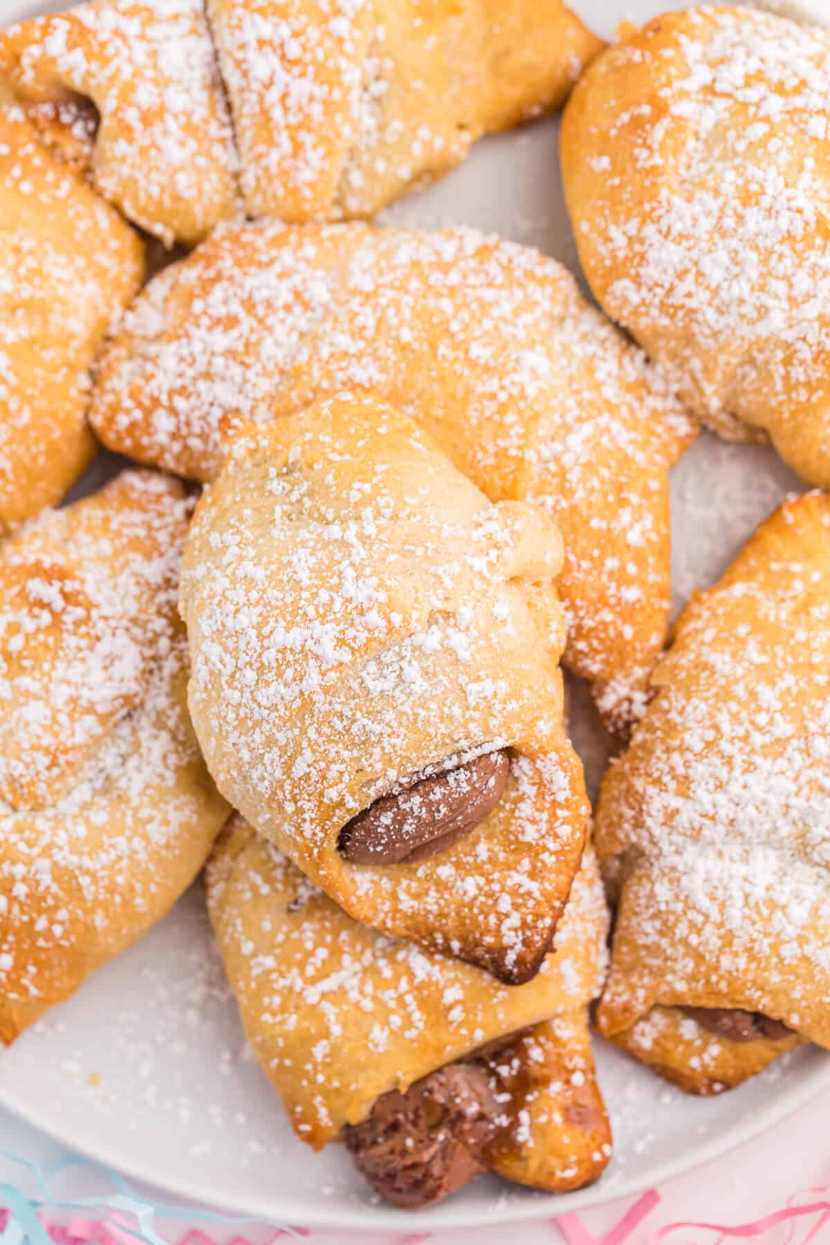 Easter egg stuffed crescent rolls on a plate.