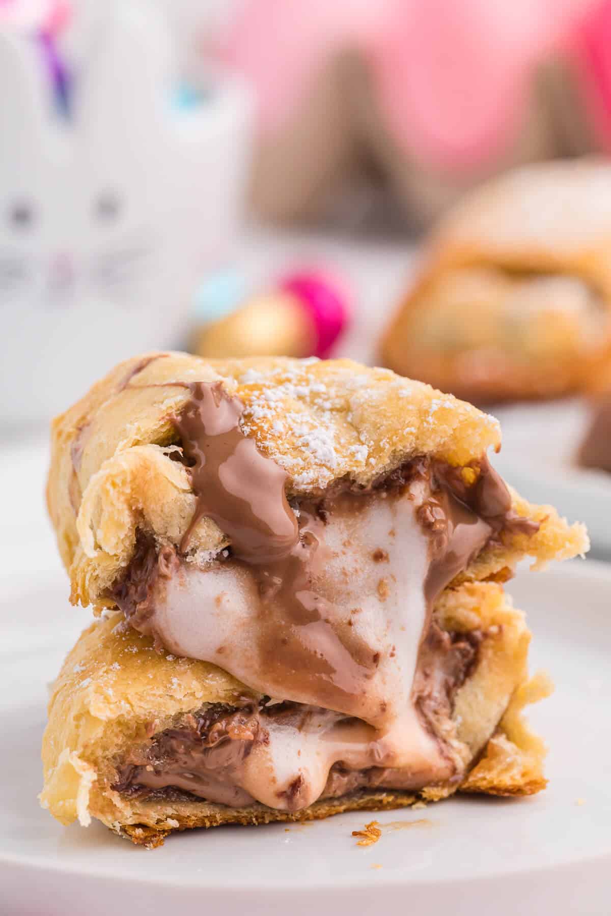 A cut Easter Egg Crescent Roll on a plate.