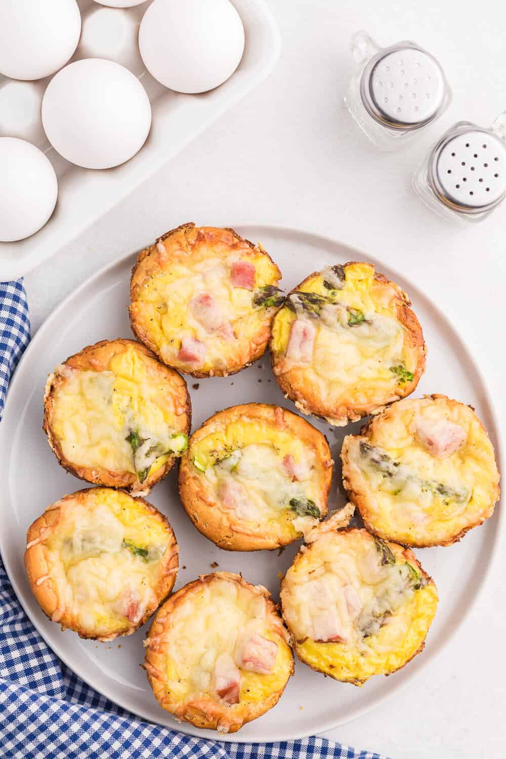 Ham, Asparagus & Swiss Biscuit Cups - These flaky bite-sized biscuits are loaded with ham, Swiss and asparagus, but can be completely customized to your family's taste buds!