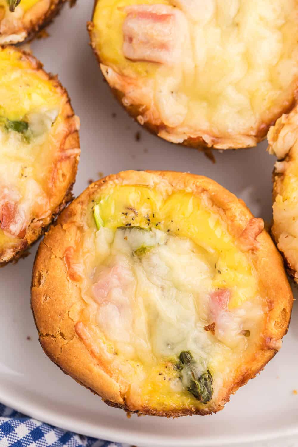 Ham, Asparagus & Swiss Biscuit Cups - These flaky bite-sized biscuits are loaded with ham, Swiss and asparagus, but can be completely customized to your family's taste buds!
