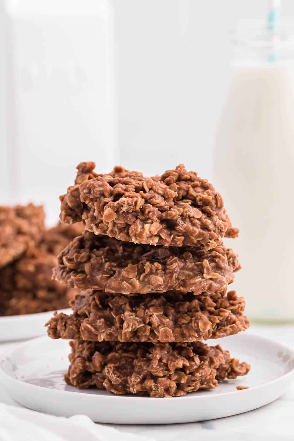 no bake chocolate peanut butter cookies stacked on a plate