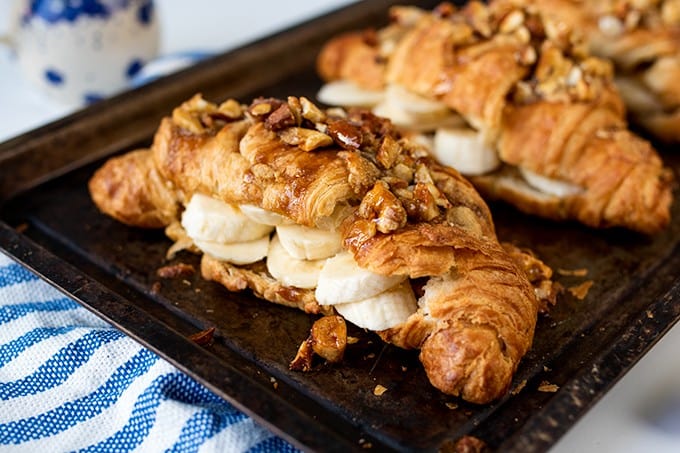 Sticky banana croissants on a baking sheet.