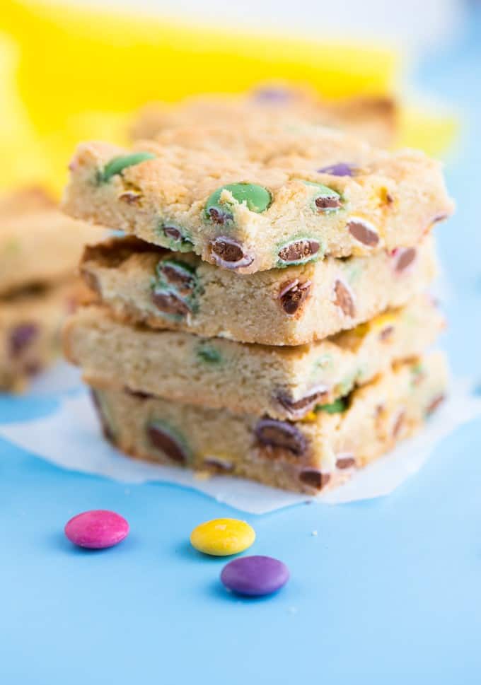 Smarties Blondies - Chewy and sweet bars dotted with delicious candy coated chocolate Smarties. You may want to double the batch because these are gone in a flash!