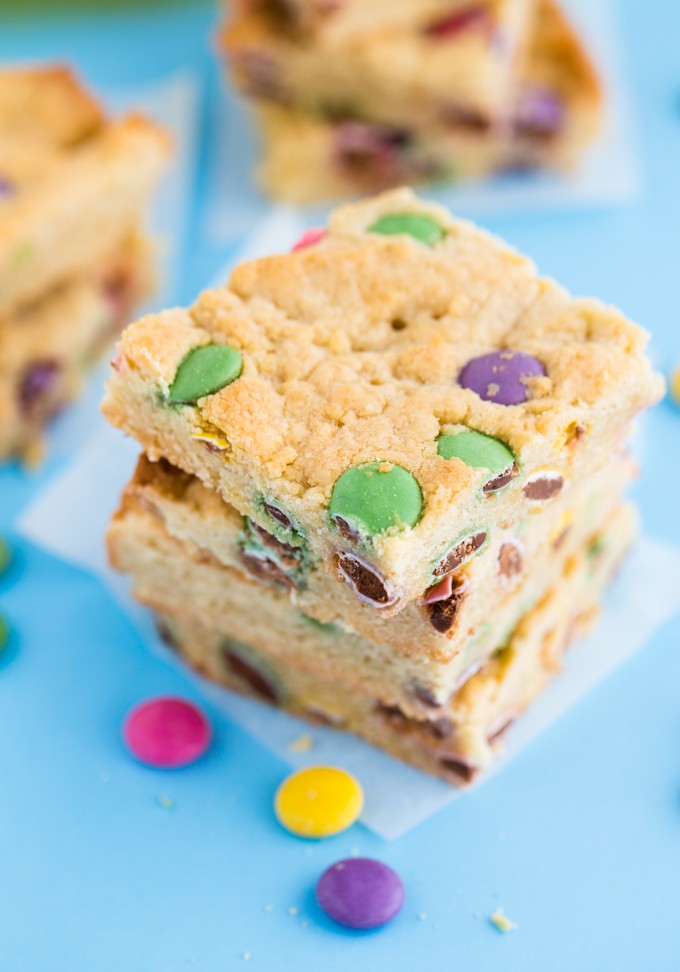 Smarties Blondies - Chewy and sweet bars dotted with delicious candy coated chocolate Smarties. You may want to double the batch because these are gone in a flash!