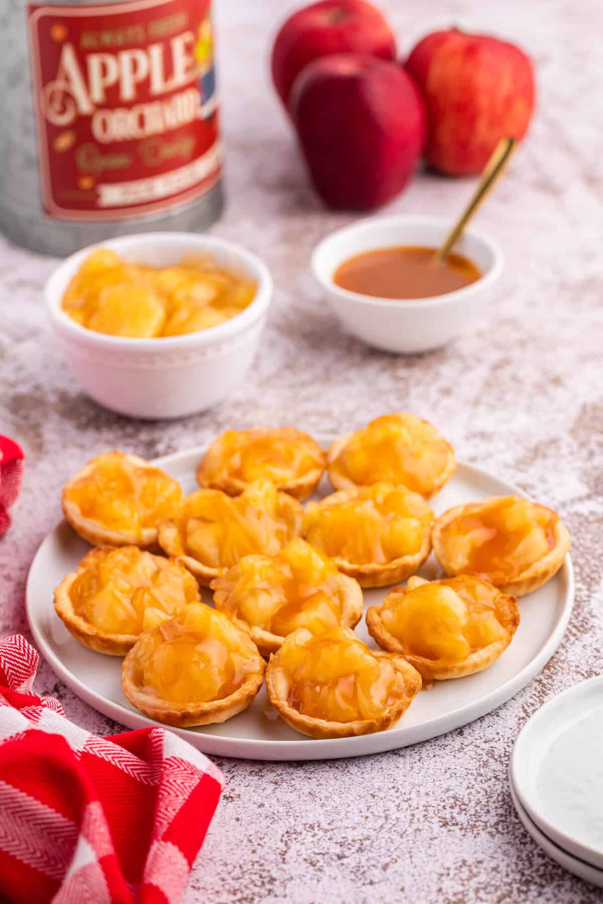 Caramel apple tarts on a plate.