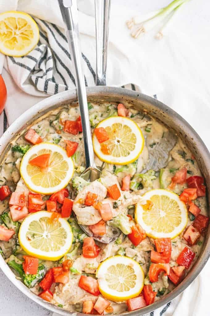 Lemon & Herb Chicken Fettuccine - Your family will love this fresh and healthy springtime meal! Fresh herbs, lemons and chicken in a creamy sauce are served over a bed of fettuccine. Delish!