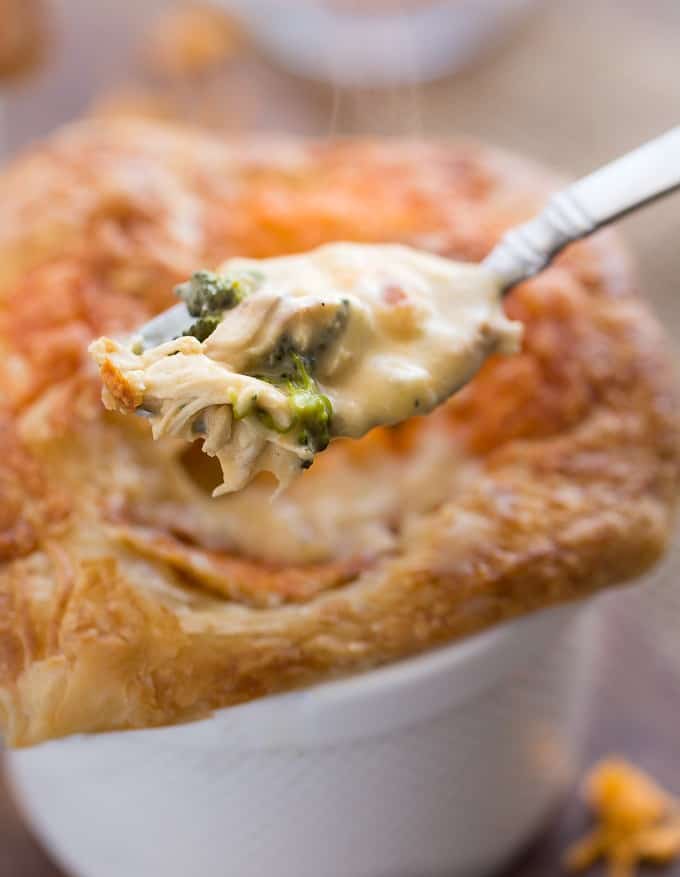 Chicken, Broccoli & Cheddar Pot Pies - Super cheesy and flavourful with a thick, creamy filling of savoury veggies, tender chicken and melted cheese baked in an ovenproof ramekin!