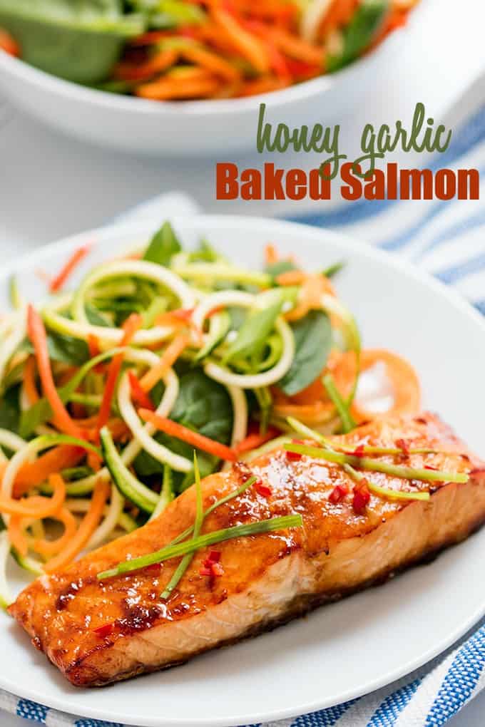 Honey Garlic Baked Salmon - This Asian-inspires salmon dish is as healthy as it is delicious! The simple sesame oil, soy sauce, and honey marinade makes even fish haters love this main dish.