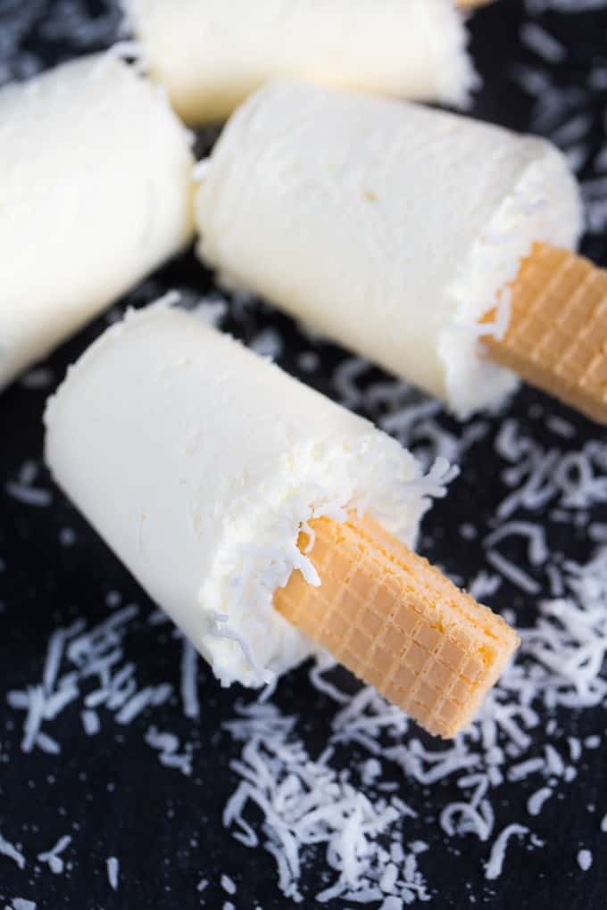 Coconut Creme Ice Pops - Cold, creamy and perfectly sweet! This summer treat tastes like a coconut cream pie.