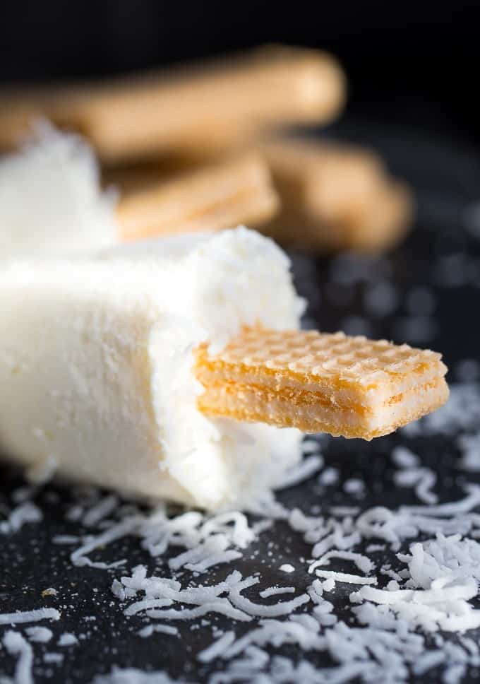 Coconut Creme Ice Pops - Cold, creamy and perfectly sweet! This summer treat tastes like a coconut cream pie.