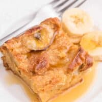 The recipe on a plate with a fork and sliced bananas.