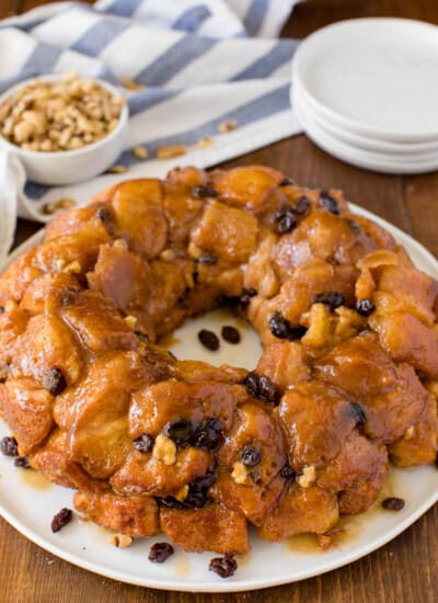 Classic Monkey Bread Recipe - Easy pull-apart bread swimming with walnuts, raisins, and a sweet glaze. Made for breakfast or dessert!
