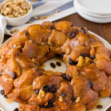 Classic Monkey Bread Recipe - Easy pull-apart bread swimming with walnuts, raisins, and a sweet glaze. Made for breakfast or dessert!