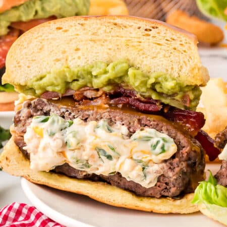 Cream cheese stuffed jalapeno burger on a plate.