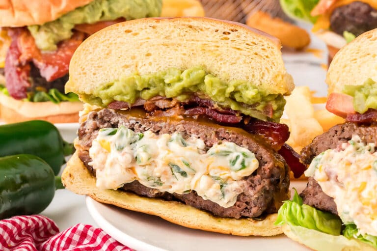 Cream cheese stuffed jalapeno burger on a plate.