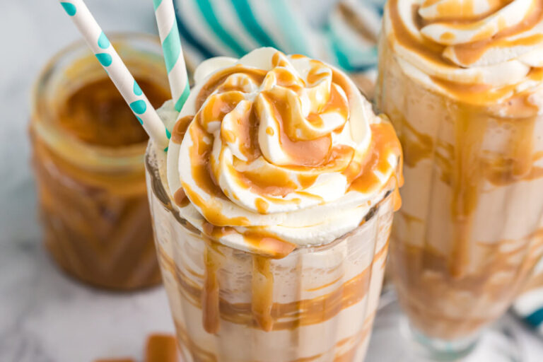 A milkshake with two straws.