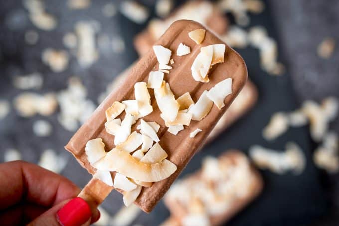 Toasted Coconut Fudgsicles - Get grown-up with these fudgsicles! A topping of toasted coconut makes the chocolate flavors pop.