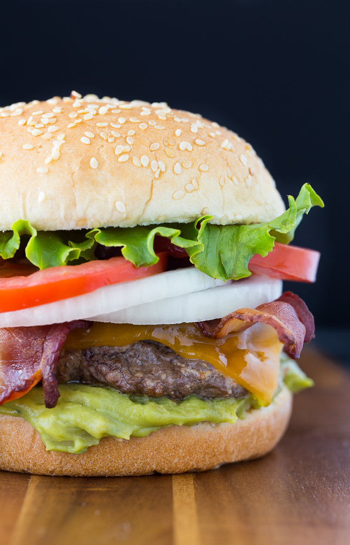 Cream Cheese Stuffed Jalapeno Burgers - Skip the jalapeño poppers and put them in your burger! These stuffed cheeseburgers are filled with a creamy and spicy center for a flavor explosion.