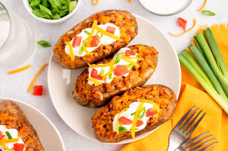 Chicken taco twice-baked potatoes on a plate.