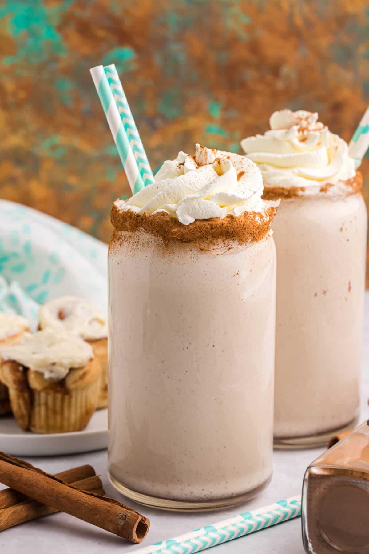 Two glasses of cinnamon roll coffee milkshakes.