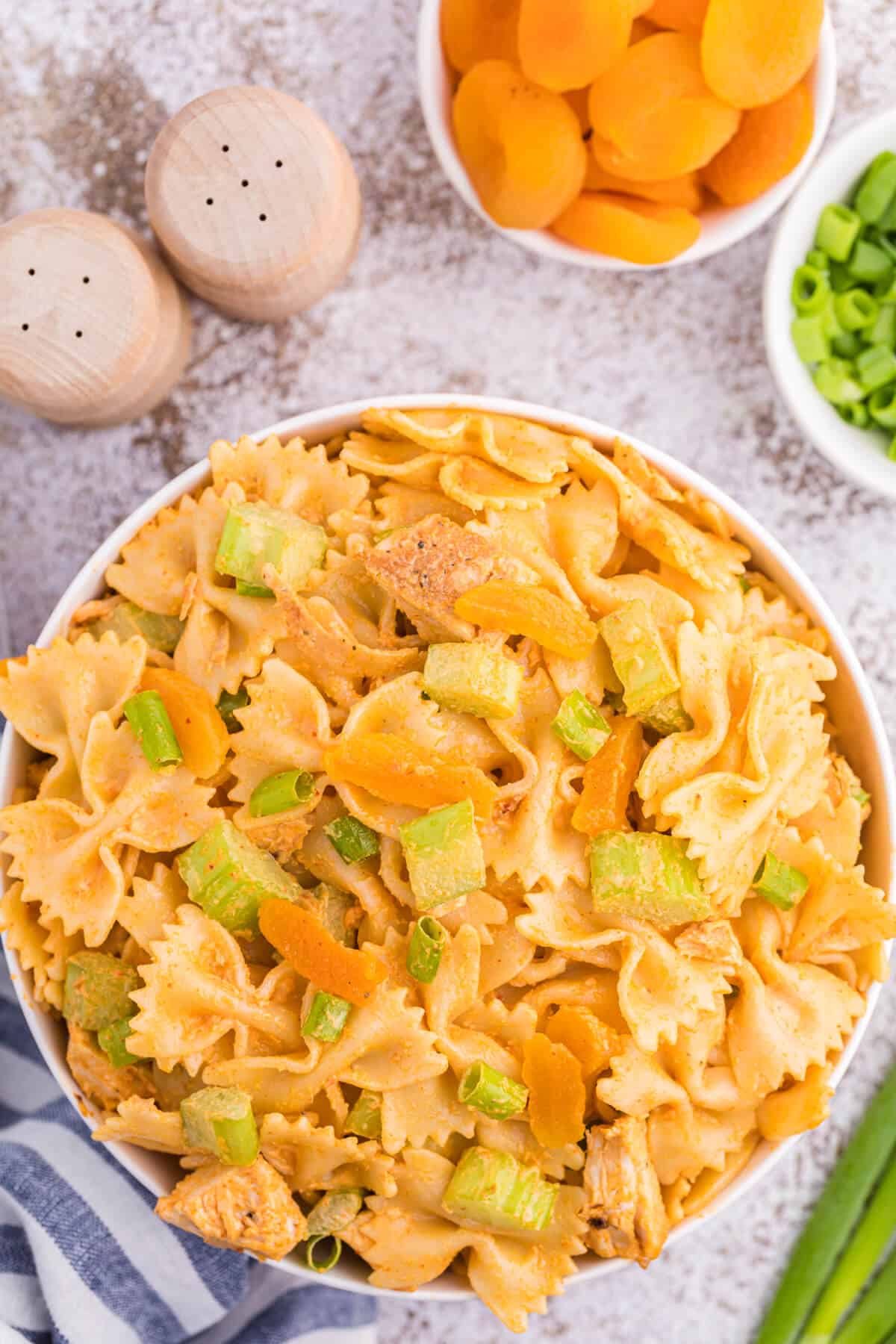 A bowl of creamy curried chicken pasta salad.