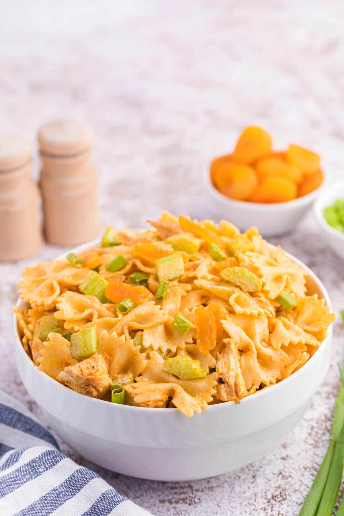 A bowl of creamy curried chicken pasta salad.