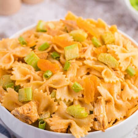 A bowl of creamy curried chicken pasta salad.