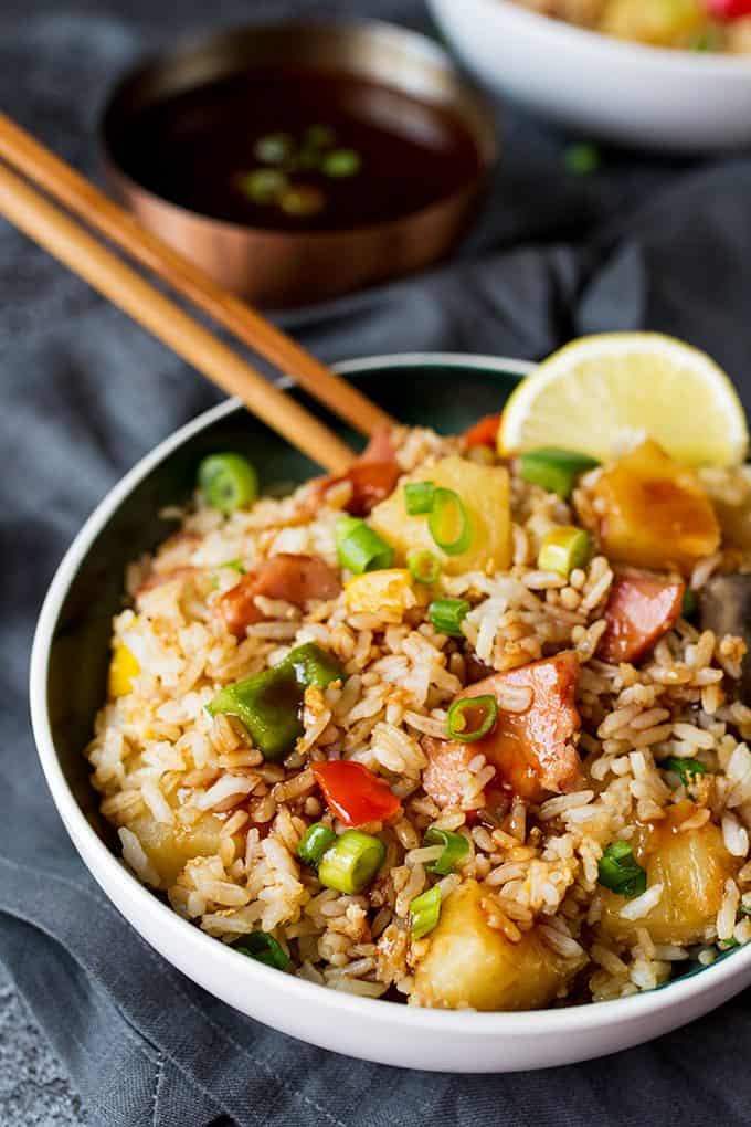 Hawaiian fried rice in a bowl with chopsticks.