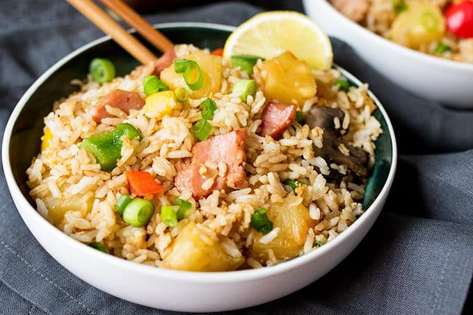 Hawaiian fried rice in a bowl with chopsticks.