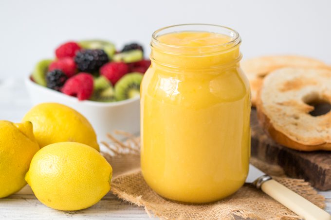 Homemade lemon curd in a glass jar.