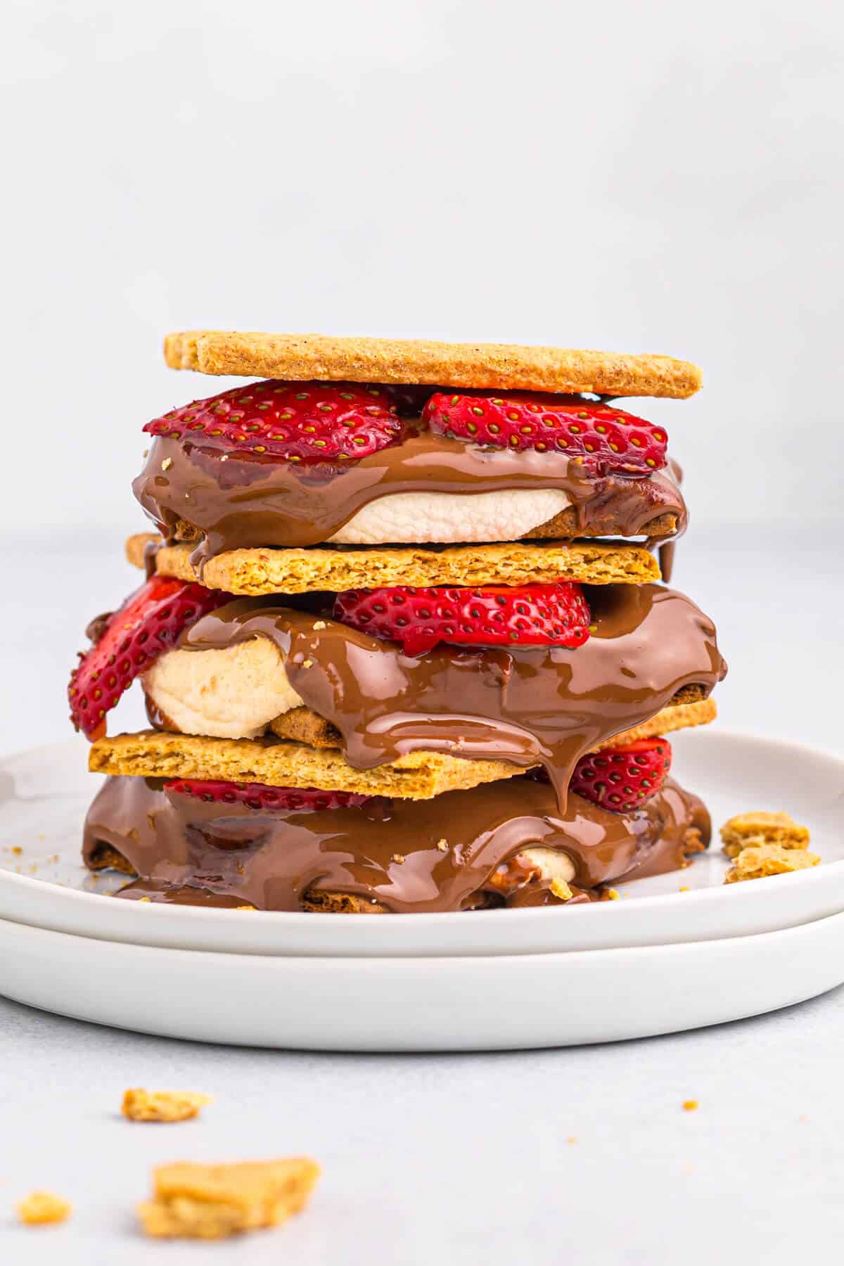 A stack of strawberry s'mores on a plate.