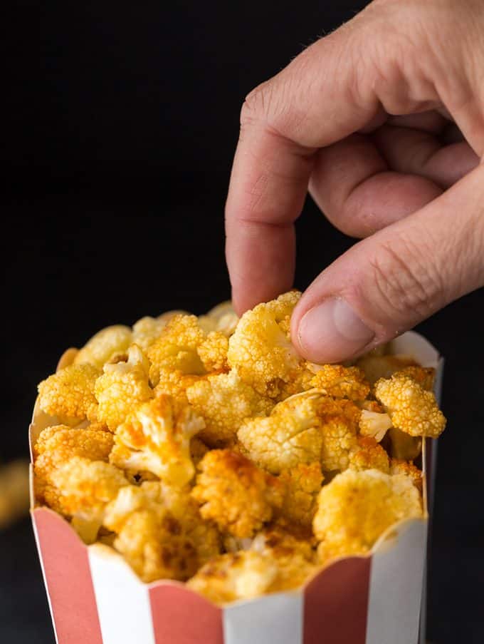 Buffalo Popcorn - The easiest low carb snack! Satisfy your salty cravings with this bite-size cauliflower drizzled in popcorn seasoning.