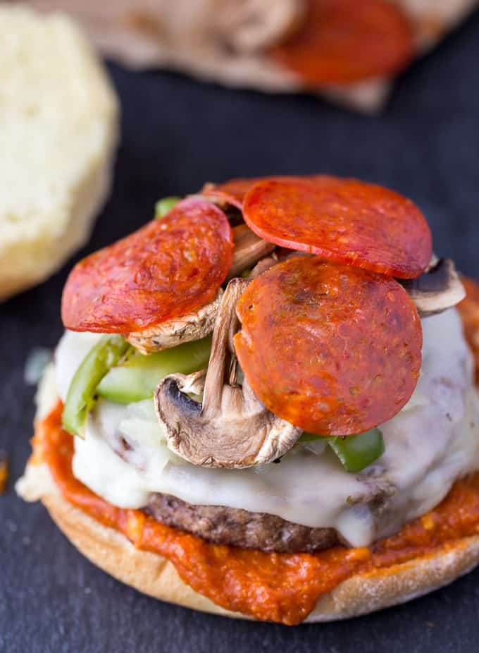 Deluxe Pizza Burgers - Loaded to the max with all your favourite pizza toppings. Take one bite and you'll see why my family raves about these delicious burgers!