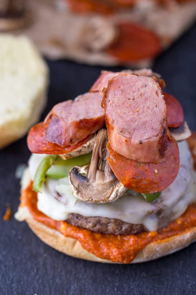 Deluxe Pizza Burgers - Loaded to the max with all your favourite pizza toppings. Take one bite and you'll see why my family raves about these delicious burgers!