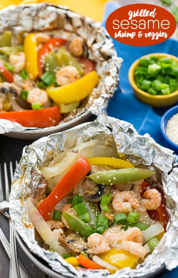 Grilled Sesame Shrimp & Veggies - This summer grilling recipe is a triple whammy - it's easy to prep, simple to cook and fast to clean up afterwards. Your family will love these individual foil packets filled with veggies, shrimp and a mouthwatering sesame sauce. 