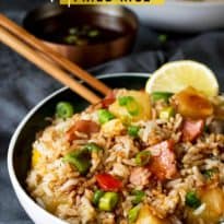 Hawaiian Fried Rice with Easy Sweet and Sour Sauce - Fried rice with pineapple may sound strange, but after you try this recipe, you'll see that it just works! It's made with big chunks of ham and pineapple, veggies and an addicting sweet and sour sauce.