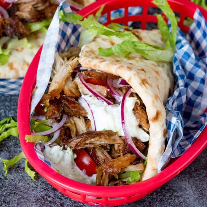 Pork Gyros with Tzatziki and Sweet Chili Sauce - Calling all carnivores! These pulled pork gyros are the perfect Greek night recipe with homemade sauces.