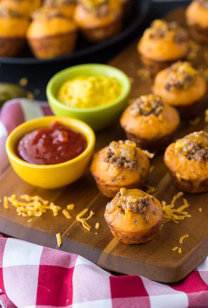 Cheeseburger Muffins - These tailgate treats are stuffed with your favorite burger toppings! Delicious dipped in ketchup and mustard.