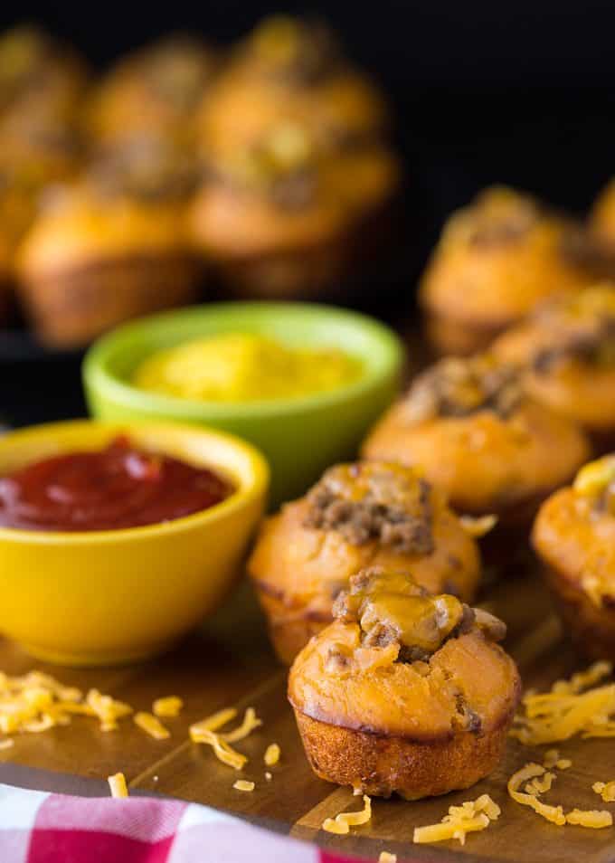 Cheeseburger Muffins - These tailgate treats are stuffed with your favorite burger toppings! Delicious dipped in ketchup and mustard.