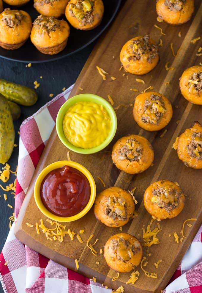 Cheeseburger Muffins - These tailgate treats are stuffed with your favorite burger toppings! Delicious dipped in ketchup and mustard.