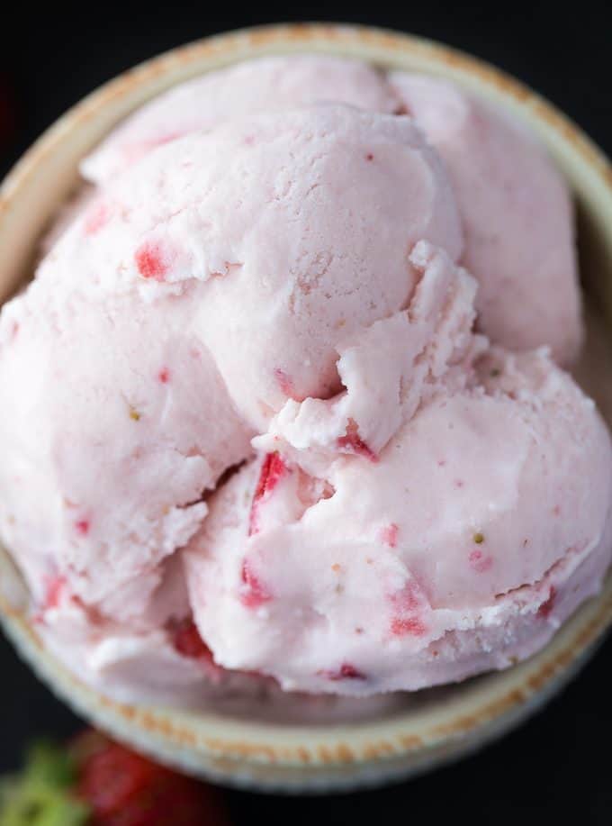 Strawberry Ice Cream - So creamy, sweet and luscious! This fresh ice cream recipe is ready in a matter of hours and super simple to make at home with your ice cream maker.